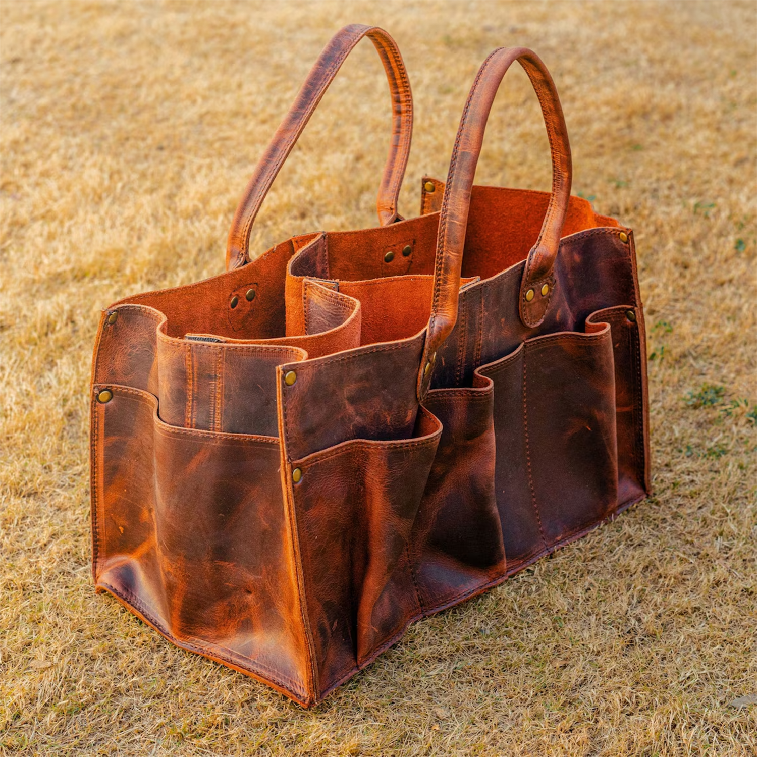 Vintage Aged Brown Distressed Utility Tote With Multi Segmented Slip Pockets, Curved Wide Carry Loops And Brass Rivet Reinforced Paneling Tool Bag