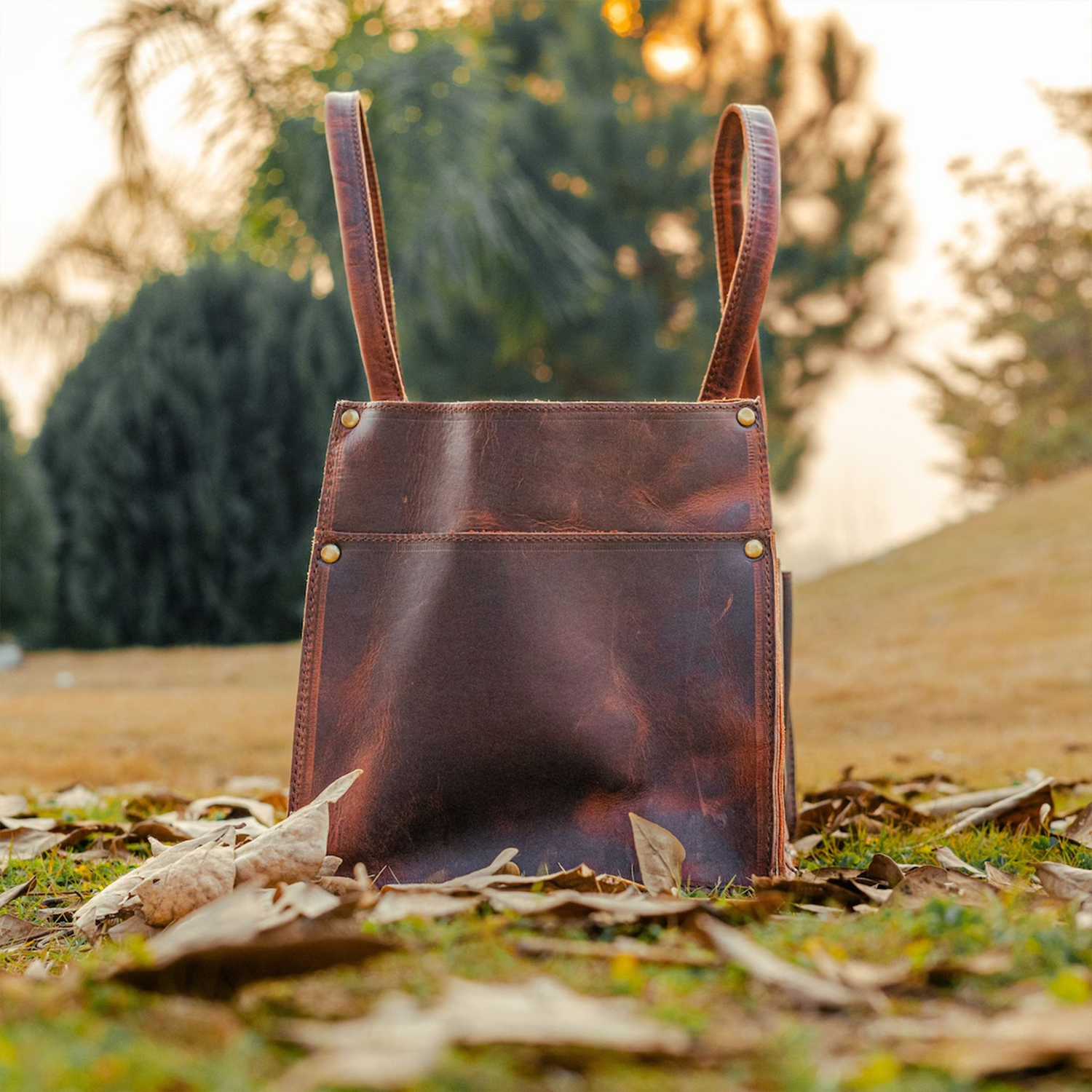 Vintage Aged Brown Distressed Utility Tote With Multi Segmented Slip Pockets, Curved Wide Carry Loops And Brass Rivet Reinforced Paneling Tool Bag