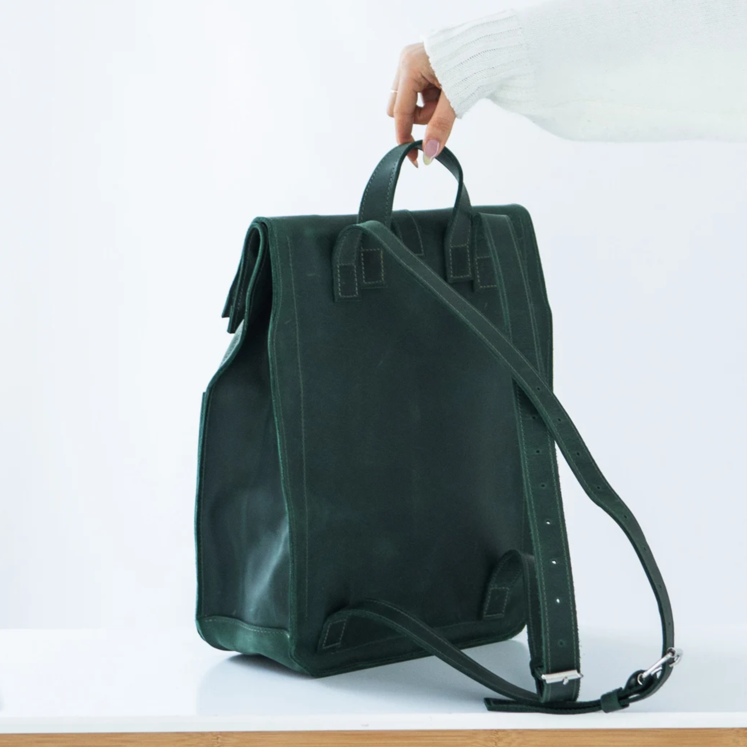 Spruce Green Matte Minimalist Rectangular Rucksack With Top Hand Grip Tab, Dual Ring Flap Clasp And Adjustable Backpack Shoulder Straps